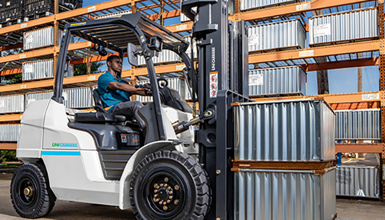 Man lifting steel rods using a Mitsubishi forklift truck